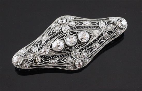 A 1920s platinum and gold, diamond set brooch, 2.25in.